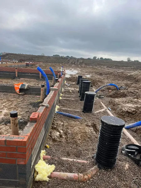 New build foundation brick and block walls with drainage chambers during groundwork