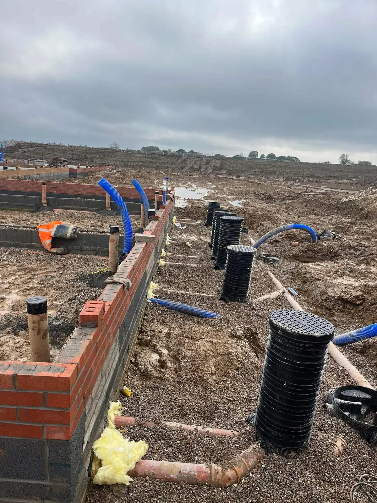 New build foundation brick and block walls with drainage chambers during groundwork