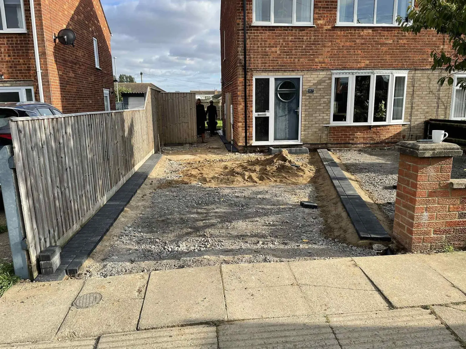Semi detached front drive dug out with charcoal block edging going in during work