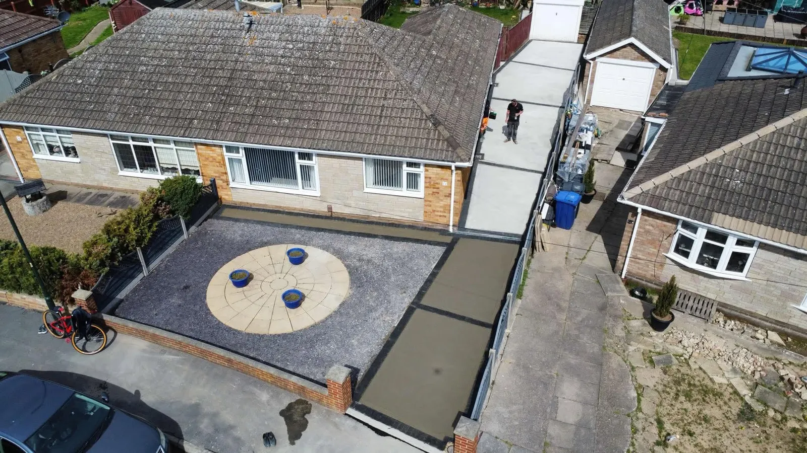 Aerial concrete drive with block edging and slate garden feature after completion