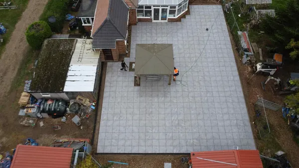 Straight down aerial of large porcelain patio and gazebo after completion