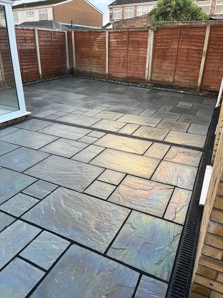 Sandstone patio with recessed channel drain after completion
